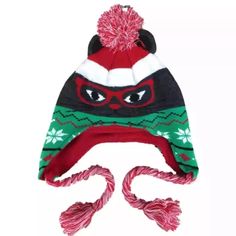 a knitted hat with a red and green mask on it