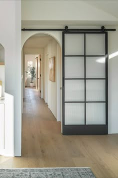 interior steel barn door Black Barn Doors, Modern Sliding Doors Interior, Arched Barn Door, Glass Sliding Doors Interior, Modern Sliding Glass Doors, Sliding Pantry Doors, Bathroom Barn Door, Modern Sliding Barn Door, Interior Barn Door