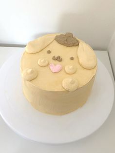 there is a cake that looks like a dog on the plate