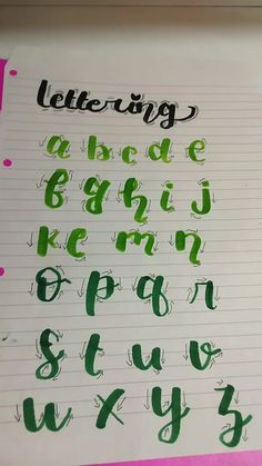 a sheet of paper with writing on it and some type of letters written in green ink