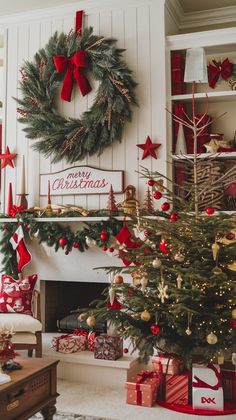 a living room decorated for christmas with red and green decorations