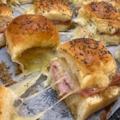 ham and cheese sliders with melted cheese on them are ready to be served in the oven