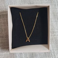 Nib "A" Gold Necklace Contemporary Gold Plated Chain Necklace With "A" Pendant. I Actually Got This On Etsy As A Gift For One Of My Bridesmaids, But Decided To Go A Different Way. (With The Gift, Not The Bridesmaid Lol). Perfect For Gifting! Comes In The Cute Little Pine Box. Brand New; Never Worn Or Even Taken Out Of The Box. All Reasonable Offers Accepted! Message Me For Free Shipping On Orders Over $50! Create A Bundle To Get The Best Price. Message Me With Any Questions! Yellow Clavicle Chain Necklace For Gift, Yellow Clavicle Chain Necklace As Gift, Yellow Charm Necklace With Adjustable Chain As Gift, Yellow Initial Pendant Necklace For Gifts, Elegant Yellow Charm Necklaces For Gifts, Elegant Yellow Charm Necklace For Gift, Dainty Yellow Necklace For Gift, Dainty Yellow Necklace For Gifts, Elegant Personalized Yellow Necklace