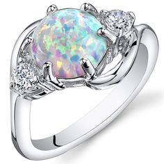 Moonlit magic
It's the simple things in life. These whimsical and playful Opal colors will dance with you all day (and night).
This graceful ring features a round shape Peora created Opal gemstone in .925 sterling silver.
Responsibly sourced in every sense, our created Opal gemstones are physically, chemically, and optically identical to their natural counterparts. We're big fans of eco-luxury.
Handcrafted in pure .925 sterling silver goodness, this ring has been carefully coated in an elegant rhodium finish. Our artisans are expertly trained in this process which fortifies the ring's strength, shine and brilliance.
Main Stone
Lab Created Opal
1.75 Carats, round shape, 8 x 8 mm
White color with a SI1-SI2 clarity
Accent Stone
Cubic Zirconia
Round shape, 1 x 1 mm
White color with a VS1-VS2 c White Opal Ring, Ring Opal, Fire Opal Ring, Opal Stone, Opal Ring, Sea Glass Jewelry, White Opal, Vintage Bracelets, Opal Rings