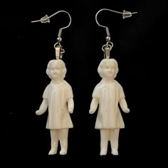 "Pieces are attached using a special jewelry adhesive. Please read descriptions thoroughly for sizes and materials.  Do your friends think you're a little different? Do you like things at are a little eerie? Then these earrings are for you. They feature white resin Victorian style dolls. They hang lifelessly from your ears. They are hung from standard hypoallergenic ear wires. Earrings are also available to be hung on 925 Sterling Silver ear wires, clip ons, 16-18mm Surgical Steel Hoops or 12-14 Creepy Jewelry Diy, Odd Earrings, Creepy Earrings, Doll Earrings, Frozen Charlotte, Victorian Dolls, Unusual Earrings, Creepy Dolls, Ancient Jewelry