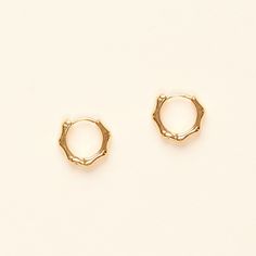 "A new take on classic gold hoops, these geometric hoop earrings are perfect to wear alone or stacked with other earrings for a modern look. They are adorable and dainty. - Materials: 18K gold plated brass and silver posts - Measurements: approximately 0.4\" / 1cm in diameter - The product is tarnish-resistant. The posts are hypoallergenic Q&A 1. What is the material? - It is made from 18K real gold brass 2. Does the color tarnish? - This material is water-resistant. It won't turn your skin gree Minimalist Gold-plated Circle Earrings, Minimalist Gold Plated Circle Earrings, Minimalist Tarnish-resistant Huggie Earrings, Gold Minimalist Tarnish-resistant Cartilage Earrings, Minimalist Metal Hoop Earrings Tarnish Resistant, Gold Plated Minimalist Round Cartilage Earrings, Minimalist Gold-plated Cartilage Earrings, Minimalist Gold Plated Drop Huggie Earrings, Minimalist Metal Round Huggie Earrings