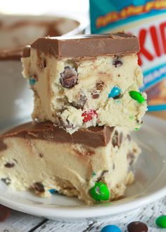 two pieces of cake sitting on top of a white plate next to a can of cereal