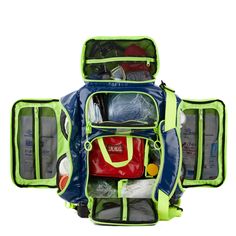 an open backpack filled with various items on top of it's back straps and zippers