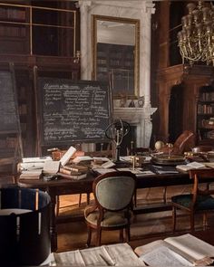 an old library with many books and writing on the chalkboard, in front of a chandelier