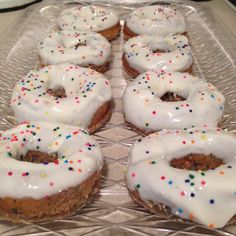 there are many donuts with white frosting and sprinkles on them