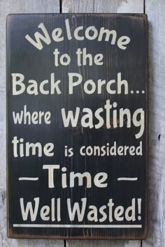 a wooden sign that says welcome to the back porch where washing time is considered time well wasted