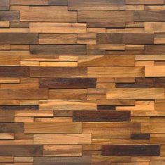 a wall made out of wooden planks with different types of wood on top of it