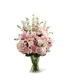 a vase filled with lots of pink flowers