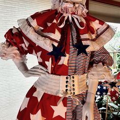 a mannequin dressed in red, white and blue with stars on it's chest