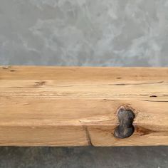 a piece of wood that has been turned into a bench with a hole in it