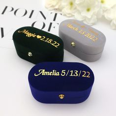 two personalized jewelry boxes sitting next to each other on top of a white table