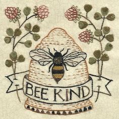 a bee is sitting on top of a piece of cloth with the words be kind