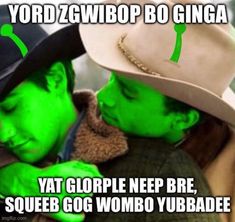 two people with green paint on their faces, one wearing a cowboy hat and the other in