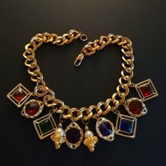 Very chic imposing vintage 80's NECKLACE, in gold metal with multicolored charms, good condition. Multicolor Jeweled Costume Jewelry Necklaces, Metal Costume Jewelry Necklace With Jewels, Gold-tone Metal Necklace With Jewels, Gold-tone Jeweled Metal Necklaces, Costume Jewelry Brass Necklaces With Jewels, Brass Costume Jewelry Necklaces With Jewels, Gold Metal Charm Necklaces With Jewels, Gold-tone Jewel Necklace In Metal, Gold-tone Jeweled Metal Necklace