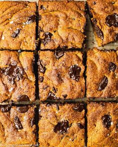 chocolate chip cookie bars cut into squares on top of each other, ready to be eaten