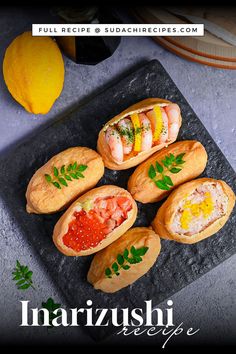 Inarizushi (inari sushi/ stuffed tofu touches) with various toppings on a slate style square plate