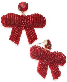 the red bow earrings are adorned with crystal stones