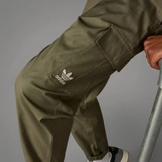 adidas Enjoy Summer Cargo Pants - Green | Men's Lifestyle | adidas US Adidas Joggers With Pockets For Streetwear, Adidas Functional Outdoor Bottoms, Adidas Functional Bottoms For Outdoor Activities, Adidas Green Bottoms For Streetwear, Casual Adidas Parachute Pants With Pockets, Adidas Sporty Bottoms For Outdoor Activities, Functional Adidas Bottoms For Outdoor Activities, Adidas Bottoms With Side Pockets For Streetwear, Sporty Adidas Bottoms For Outdoor