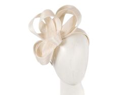 Handmade ivory cream loops of pure abaca fabric placed on the headband. Hand-made in the heart of Melbourne by our experienced milliners, this elegant racing fascinator will put finishing touches on your spring racing outfit.  Made in Australia  Eco-friendly abaca fabric  Comfortable headband Chic Kentucky Derby Headband Fascinator, Elegant Cream Hat With Bow, Elegant Beige Adjustable Fascinator, Elegant Adjustable Beige Fascinator, Elegant Spring Ribbon Fascinator, Chic Fascinator Headband For Events, Chic Headband Fascinator For Events, Elegant Ribbon Headband, Elegant Adjustable Fascinator With Matching Headband