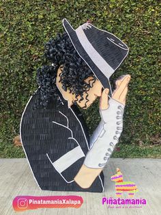 a cardboard cutout of a man wearing a hat and holding his hands to his face