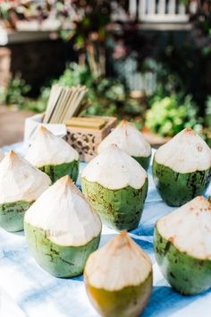 there are many coconuts on the table ready to be eaten