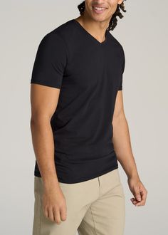 About Our Men's Tall V-Neck T-Shirts Every guy needs a basic tall t-shirt in his wardrobe. It's the quintessential base layer that you can wear throughout all the seasons. But as a tall guy, finding tees that fit your frame can be a struggle, with lengths that end awkwardly at the waist and sleeves that are just a little bit too short. That's where we come in. We set out to design the ultimate staple tee that you can wear with anything and everything, in a style crafted exclusively for tall men Black V-neck T-shirt With Moisture-wicking, Black Moisture-wicking V-neck T-shirt, Black V-neck Moisture-wicking T-shirt, Solid V-neck T-shirt With Moisture-wicking, Solid Moisture-wicking V-neck T-shirt, Black V-neck Top With Moisture-wicking, Tall Men, Men In Black, Tall Clothing