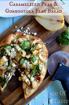 caramelized pear and gorgonzonia flat bread on a cutting board