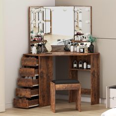 a wooden vanity with drawers and stools in front of a mirror on the wall