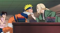 two anime characters are sitting at a desk and one is holding his face to the other