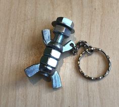 a metal keychain that has been made to look like a fish on it