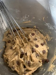 a mixing bowl filled with batter and chocolate chips