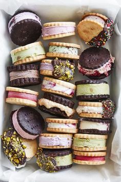 a box filled with lots of different flavored donuts