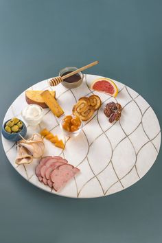 a white plate topped with different types of food on top of a blue tablecloth