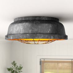 a light fixture hanging from the ceiling in a room