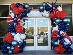 an entrance decorated with red, white and blue balloons