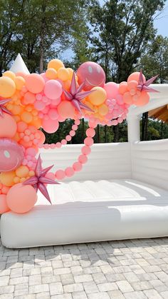 an inflatable bed with balloons and starfishs on the top is shown