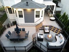 an aerial view of a deck with seating and fire pit