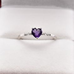 10K White Gold Heart Shape Amethyst(0.31ct) Size of stone: 4.8x4.4mm Diamond (0.02ct) Weight: 0.93 gm Made in Canada Comes with certificate Purple Heart Cut Fine Jewelry Ring, Purple Gemstone Heart Ring Fine Jewelry, Heart Cut Amethyst Birthstone Ring Fine Jewelry, Fine Jewelry Heart Cut Amethyst Ring, Fine Jewelry Amethyst Ring Heart Cut, Heart-shaped Amethyst Ring For Anniversary, Fine Jewelry Amethyst Heart Cut Birthstone Ring, Heart-shaped Amethyst Ring With Accent Stones, Purple Rings With Accent Stones For Valentine's Day