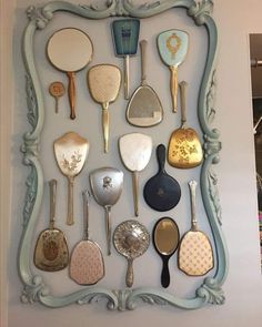 there are many different spoons on the wall