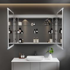 a shelf with bottles and soaps on it in a gray room next to a white counter