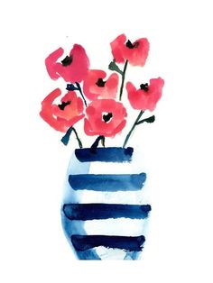 a blue and white striped vase with red flowers in it on a white tablecloth