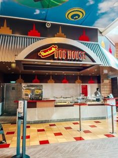 the inside of a fast food restaurant with an umbrella painted on the wall above it