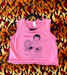 The "Love Is..." cartoons by Kim Casali are the cutest! Rare Vintage 1970s LOVE IS... Englebert Humperdinck Cartoon Graphic Cut-off Tank Top  T-Shirt Brand: Gaymode JCPenney  Size Medium  length: 16 inches  Chest: 36 inches  waist: 34 inches  armhole: 7.5 inches 1970s T Shirts, Englebert Humperdinck, Love Is, Top T Shirt, Shirt Brand, Vintage 1970s, Graphic Tank, Womens Clothing Tops, Fashion Illustration