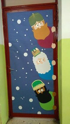 a door decorated with santa claus and other cartoon characters on blue background, in front of a green wall