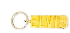 an elvis keychain with the word elvis in gold on it's side